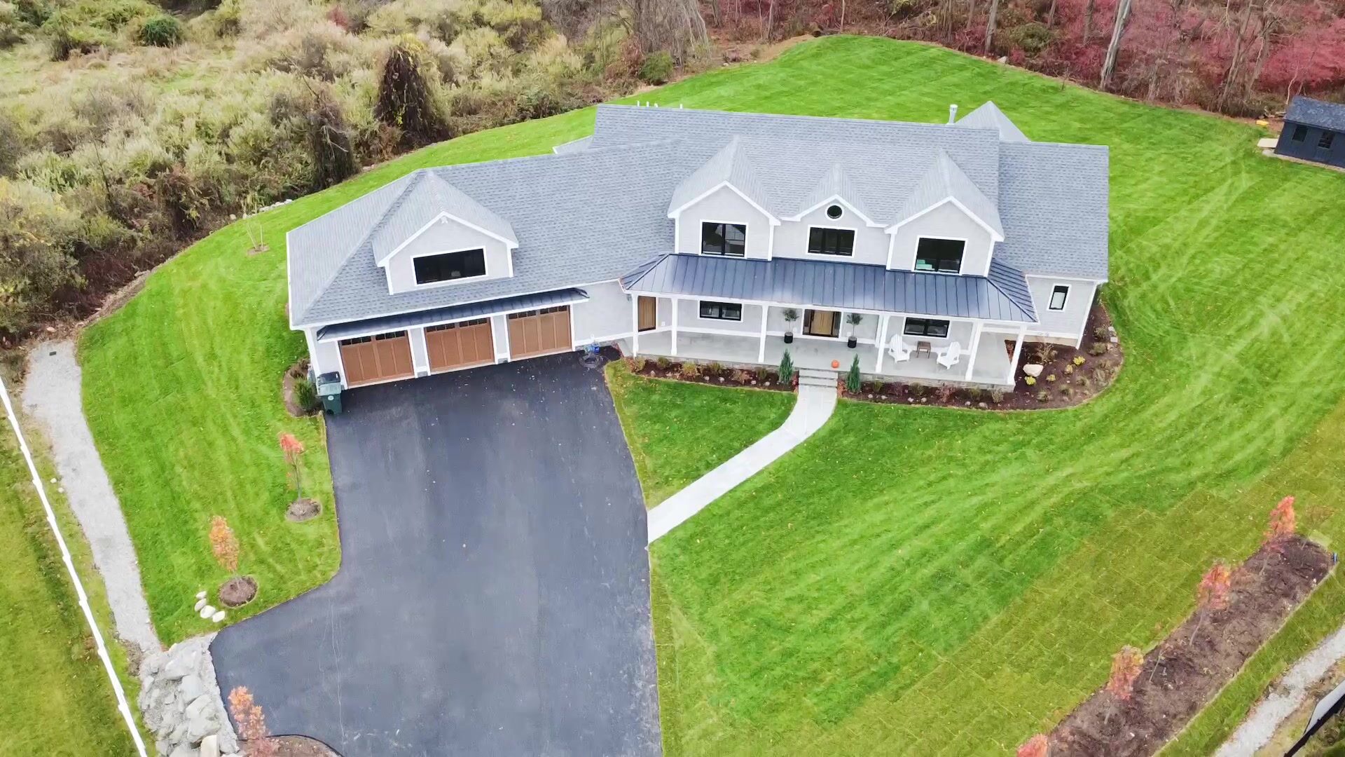 Standing seam metal porch roofing on a Trumbull CT farmhouse installed by Charter Oak Roofing